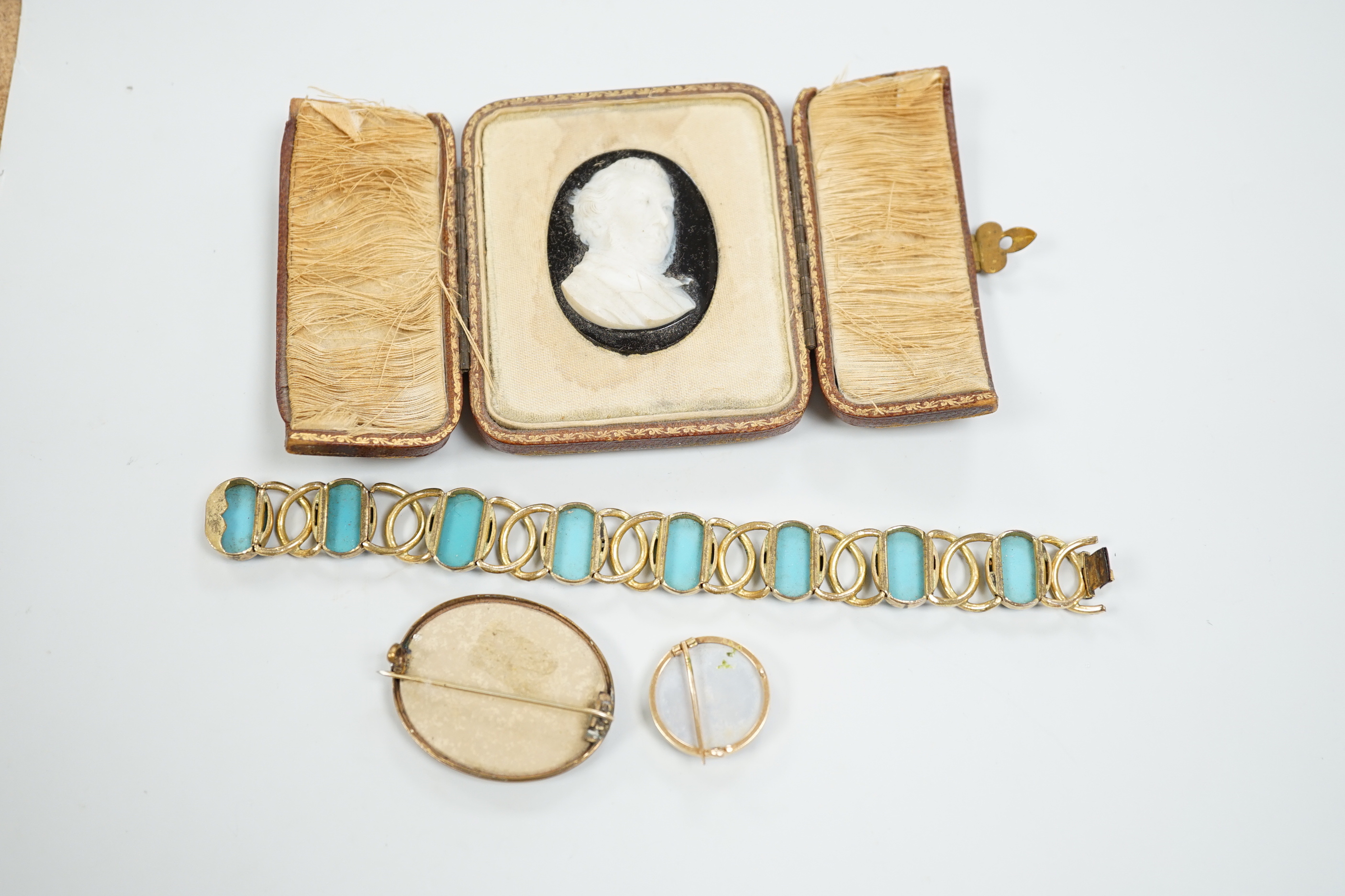 A Tassie style cased cameo, a micro-mosaic bracelet, a pietra dura brooch and a porcelain brooch.